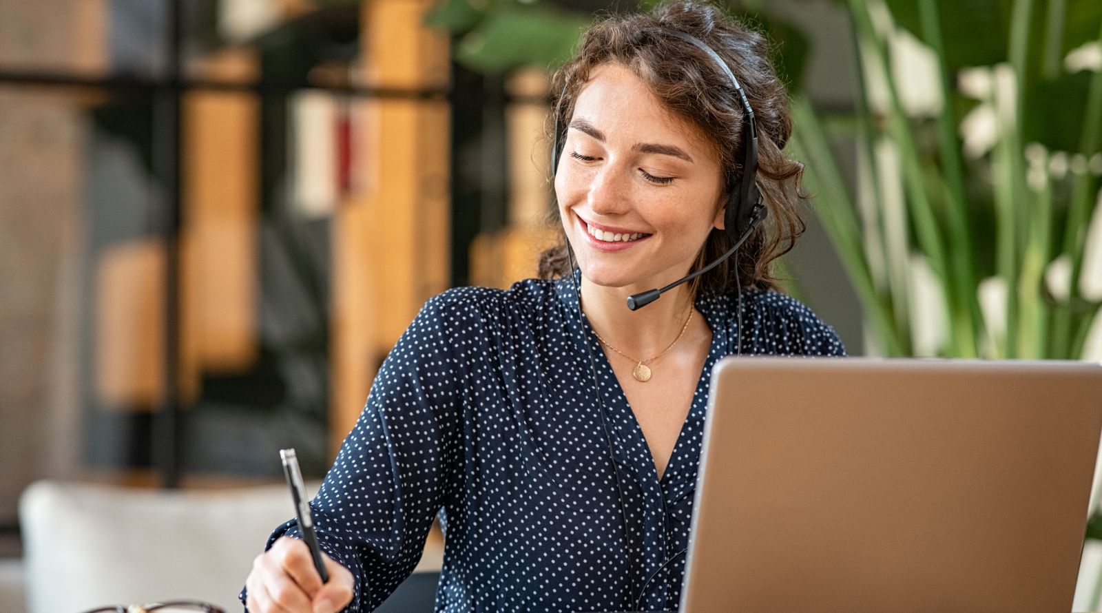 girl at computer with headset