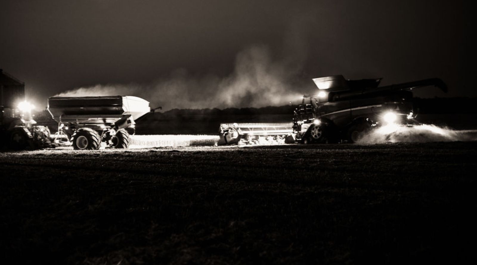 tractor harvesting. picture is in black and white